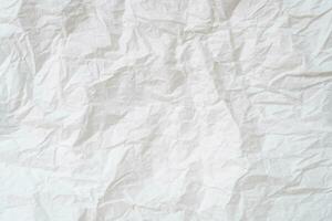Wrinkled or crumpled white stencil paper or tissue after use in toilet or restroom with large copy space used for background texture in decorative art work. photo