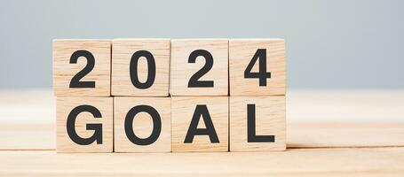 block 2024 GOAL text on table. Resolution, strategy, plan, motivation, reboot, business and New Year holiday concepts photo