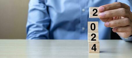 block 2024 text on table. Resolution, strategy, plan, goal, motivation, reboot, business and New Year holiday concepts photo