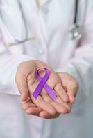 purple Ribbon for Violence, Pancreatic, Esophageal, Testicular cancer, Alzheimer, epilepsy, lupus, Sarcoidosis and Fibromyalgia. Awareness month and World cancer day concept photo