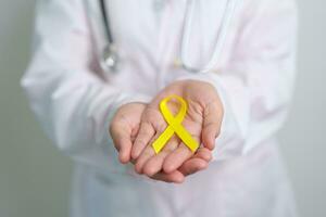 Yellow September, Suicide prevention day, Childhood, Sarcoma, bone and bladder cancer Awareness month, Yellow Ribbon for supporting people life and illness. Healthcare and World cancer day concept photo