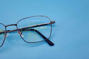 Glasses are placed on the table in the ophthalmologist. photo