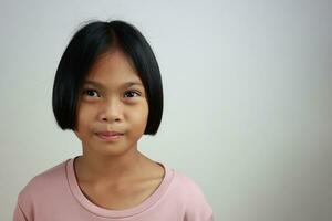 Portrait of child on the grey background photo