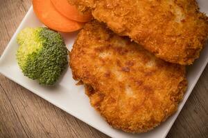 Chicken fried steak with vegetables, pancakes with garlic and herbs photo