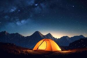 Illuminated camp tent under a view of the mountains and a starry sky. Generative AI photo