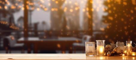 Christmas decorations on wooden floor, lights with bokeh effect in the background. photo