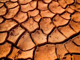 Dry cracked land in a desert, in the style of terracotta, environmental awareness. Generative AI photo