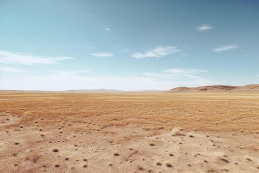 A landscape photograph featuring a vast expanse of empty space, such as a desert field. photo