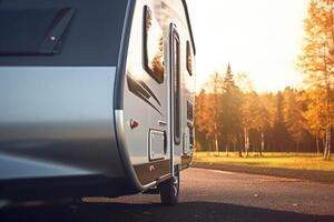 A close - up shot of a modern caravan parked, showcasing the freedom and adventure of travel. photo