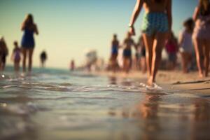 Blurred out-of-focus photo of a summer beach full of people.