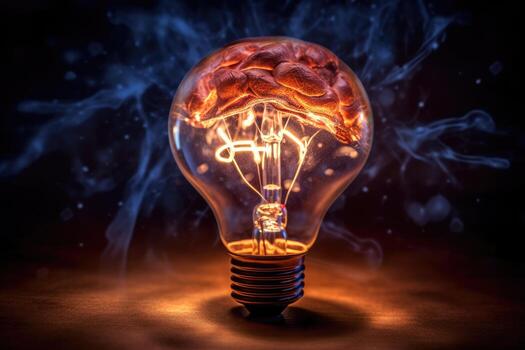 Close - up photo showcases the concept of a creative idea through the visual representation of a brain and a light bulb.