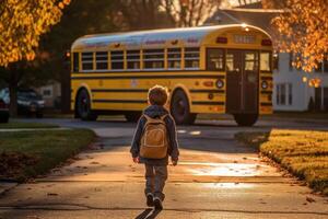 Little boy running in front of the school bus. photo