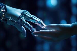 A human hand is reaching out to touch a robotic one. photo