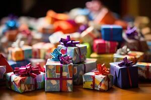 A pile of wrapped gift boxes, their colorful paper and bows. photo