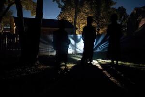 Eerie white ghosts made from sheets float in a moonlit backyard, casting long shadows. Generative AI photo