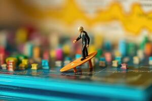 A miniature figurine surfer navigating a sea of fluctuating graphs and charts on a computer screen. photo