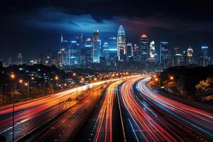 A busy highway at night, trails of light from the moving vehicles creating a dynamic pattern. photo