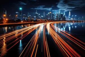 A busy highway at night, trails of light from the moving vehicles creating a dynamic pattern. photo