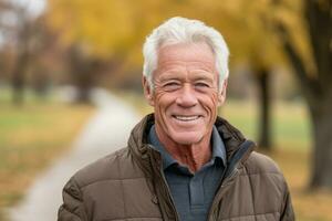 A close - up shot of a senior man enjoying a leisurely walk in a scenic park, representing active aging and healthy lifestyle. Generative AI photo