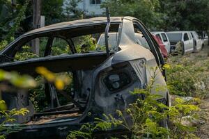 A rear view of the wreckage of black cars and others. photo