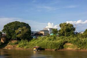 Scenery of many residential houses erected along the banks. photo