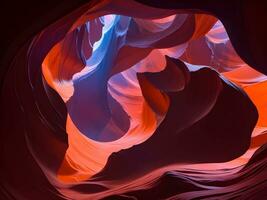 Antelope canyon with vibrant red and blue color nebula swirls photo