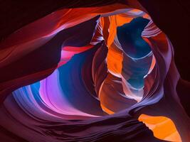 Antelope canyon with vibrant red and blue color nebula swirls photo