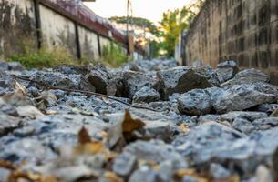 Close-up low-angle view of rubble heaps of broken concrete roads. photo