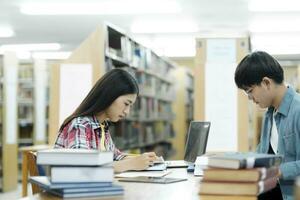 Young students campus helps friend catching up and learning. photo