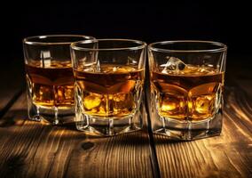 Alcohol drinks on wooden table photo