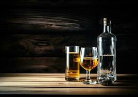 Alcohol drinks on wooden table photo