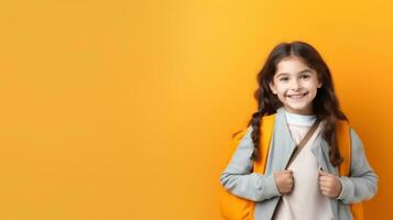 Happy school girl with backpack photo