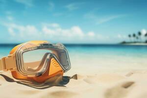 Scuba diving mask on a sandy island against blue ocean photo