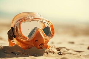 Scuba diving mask on a sandy island against blue ocean photo