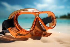 Scuba diving mask on a sandy island against blue ocean photo