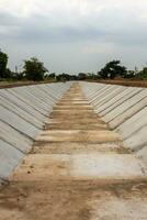 View of the concrete wall, which is built to be attached to the soil. photo
