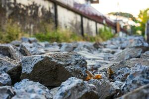 Close-up low-angle view of rubble heaps of broken concrete roads. photo