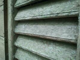 close up texture old window air vent made of wood photo