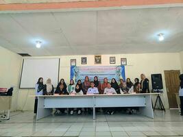 Kuaro Kalimantan Timur, Indonesia 26 July 2023. a group of Indonesian citizens holding a village meeting photo