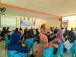 Kuaro Kalimantan Timur, Indonesia 26 July 2023. a group of Indonesian citizens holding a village meeting photo