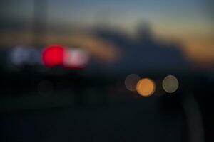 Night city street traffic abstract blurry bokeh lights background photo