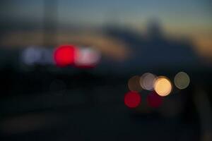 Night city street traffic abstract blurry bokeh lights background photo