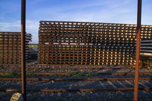 Railway Concrete sleepers stacked under the blue sky for the construction of a new track in Bangladesh photo