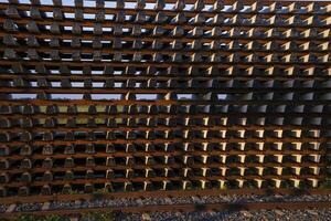 Stacked railway sleepers pattern abstract texture can be used as a background wallpaper photo