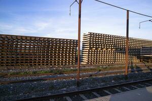 Railway Concrete sleepers stacked under the blue sky for the construction of a new track in Bangladesh photo