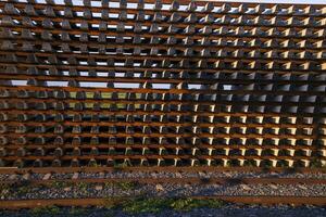 Stacked railway sleepers pattern abstract texture can be used as a background wallpaper photo