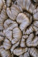 Thick Golden bundle of raw jute fiber Pattern Texture Can be used as a Background wallpaper photo