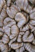 Thick Golden bundle of raw jute fiber Pattern Texture Can be used as a Background wallpaper photo