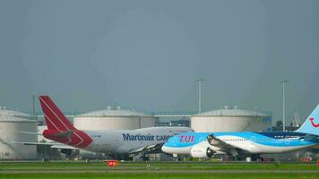 AMSTERDAM, THE NETHERLANDS JULY 26, 2017 - Martinair Cargo Boeing 747 PH MPS and TUI Fly Boeing 787 Dreamliner PH TFM before departure at runway 24 Kaagbaan. Shiphol Airport, Amsterdam, Holland video