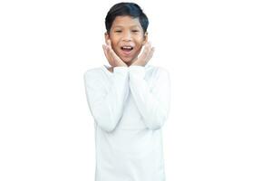 Portrait of a boy in transparent white long-sleeved shirt showing happiness on a white background. photo